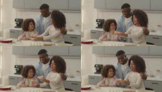 快乐的非裔美国家庭在家里厨房女人男人和小高清在线视频素材下载