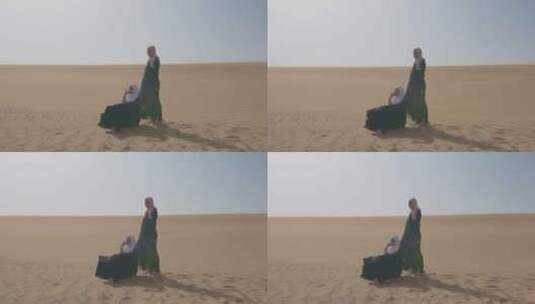 在多风的沙漠中摆姿势的女人高清在线视频素材下载