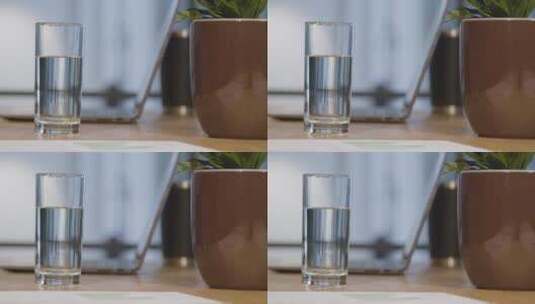 办公桌上的玻璃杯特写高清在线视频素材下载