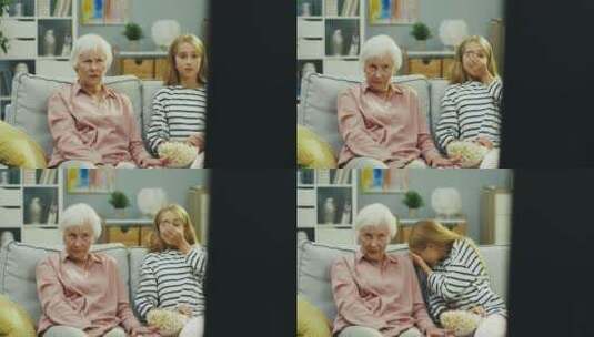 奶奶和孙女一起看电视高清在线视频素材下载