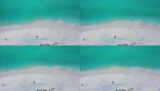 日间无人机旅行拍摄白色天堂海滩和蓝色大海背景，色彩缤纷4K高清在线视频素材下载