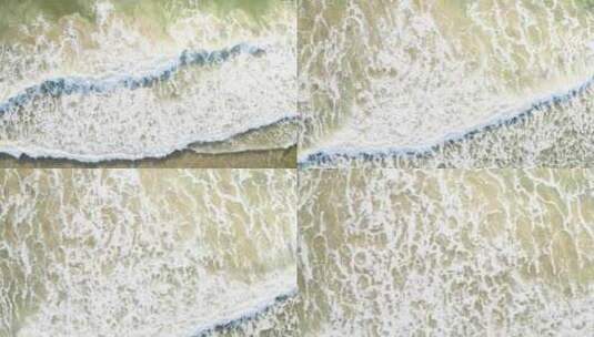 无人机俯拍被海浪冲刷的沙滩高清在线视频素材下载