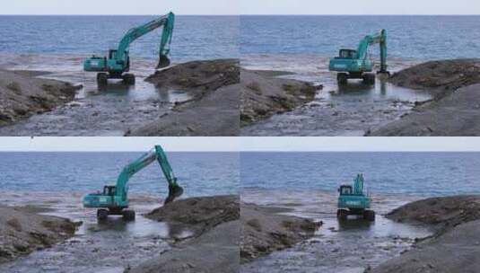 海滩上正在工作的挖土机高清在线视频素材下载