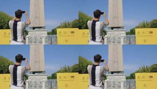 游客在纪念碑前拍照高清在线视频素材下载