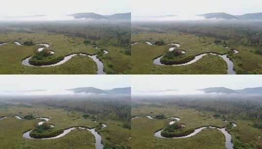 航拍林区山谷蜿蜒的小河高清在线视频素材下载