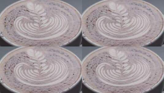 拿铁咖啡在杯子里画叶子_微距特写高清在线视频素材下载