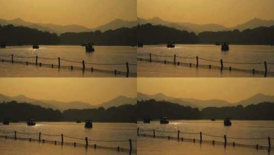 夕阳下的西湖游船与远山高清在线视频素材下载