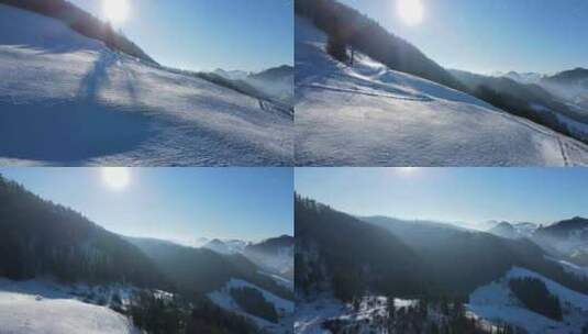 航拍被白雪覆盖的山坡洒满暖阳高清在线视频素材下载