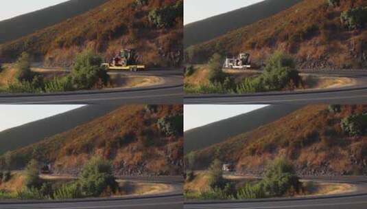 一辆拖车拉着重型设备在山路上行驶高清在线视频素材下载