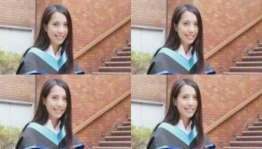 年轻的亚洲女人获得毕业高清在线视频素材下载
