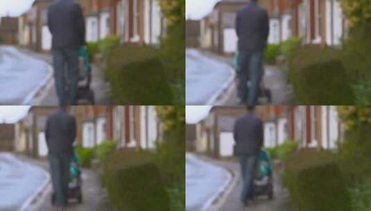 男人推着婴儿车走在街上高清在线视频素材下载