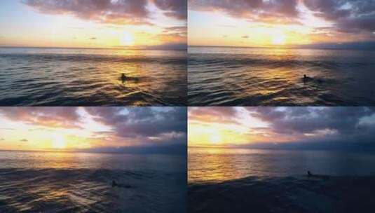 女子在风平浪静的海面上划着冲浪板进入日落高清在线视频素材下载