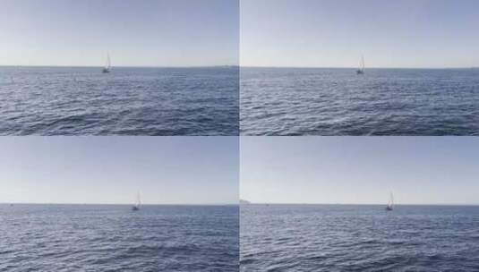 听海的声音蓝色海面与风帆高清在线视频素材下载