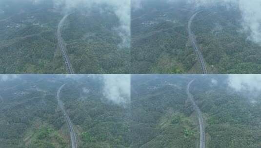 森林公路雨后森林高速公路树林汽车行驶航拍高清在线视频素材下载