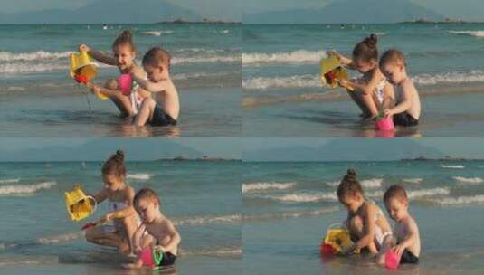 快乐无忧无虑的孩子们在海边玩沙子高清在线视频素材下载