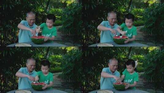 炎热夏天树下乘凉 老爷爷和孙子一起吃西瓜高清在线视频素材下载