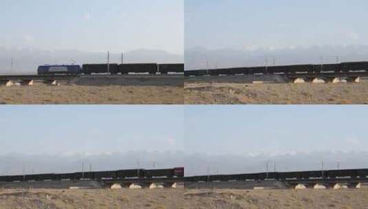 行驶在祁连山下铁道上的货运火车高清在线视频素材下载