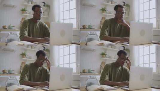 黑人男性用笔记本电脑在家工作高清在线视频素材下载
