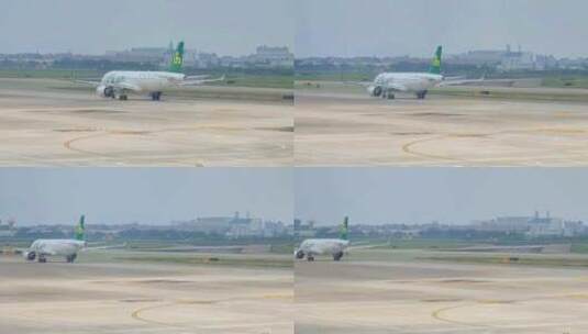 福建厦门高崎国际机场停机坪到达的春秋航空高清在线视频素材下载