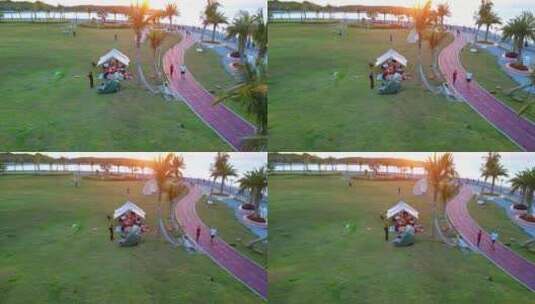 海南三亚春季阳光草坪上的露营放风筝高清在线视频素材下载