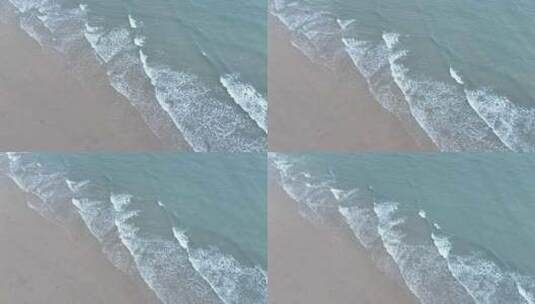 俯拍海浪拍打沙滩海水拍打岸边俯视潮水浪花高清在线视频素材下载