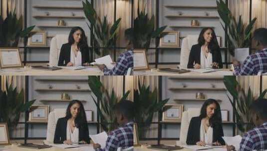 层女人与客户交谈高清在线视频素材下载