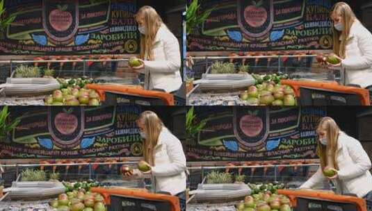 女人在市场上挑选水果高清在线视频素材下载