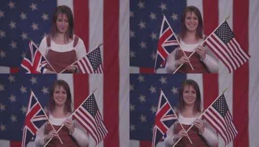 举着美国国旗和英国国旗的女人高清在线视频素材下载