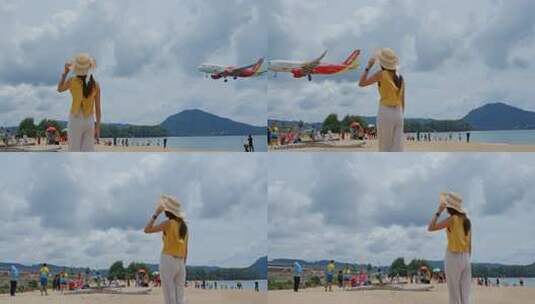 奈杨海滩，游客在海滩上看飞机高清在线视频素材下载