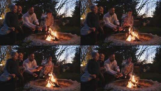 幸福家庭坐在炉火旁烤棉花糖高清在线视频素材下载