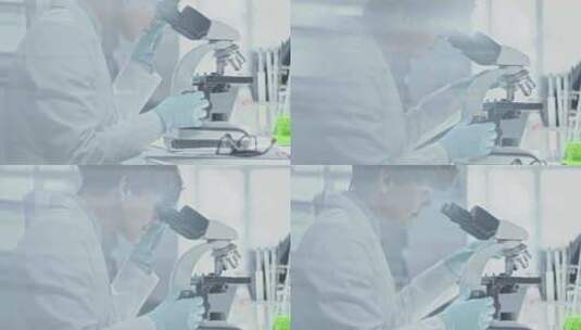 年轻科学家看显微镜高清在线视频素材下载