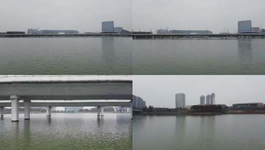 航拍扬州明月湖大桥车流京华城商圈高清在线视频素材下载