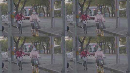 实拍上学路上骑车的小女孩高清在线视频素材下载