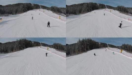 从滑雪者上空飞过_沿着积雪的丘陵而下高清在线视频素材下载