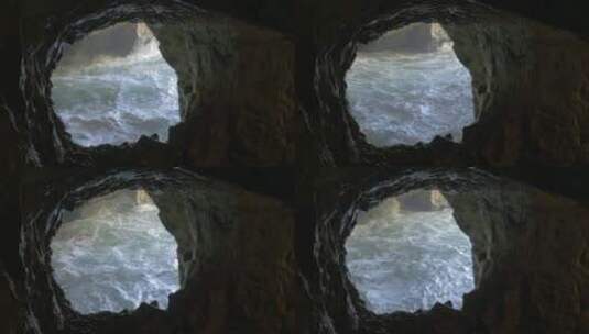 洞穴下波涛汹涌的大海高清在线视频素材下载