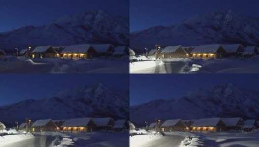冬季禾木村夜晚汽车驶过村庄高清在线视频素材下载