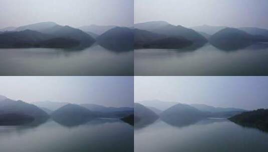平静湖面和重峦叠嶂的山脉高清在线视频素材下载