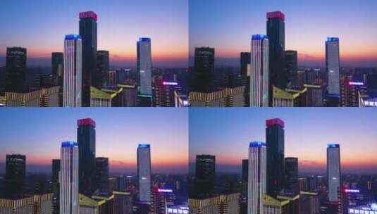 西安高新都市之门写字楼高楼大厦夕阳航拍高清在线视频素材下载