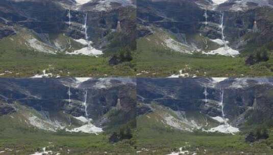 川西稻城雪山间流水瀑布绿地蓝天高清在线视频素材下载