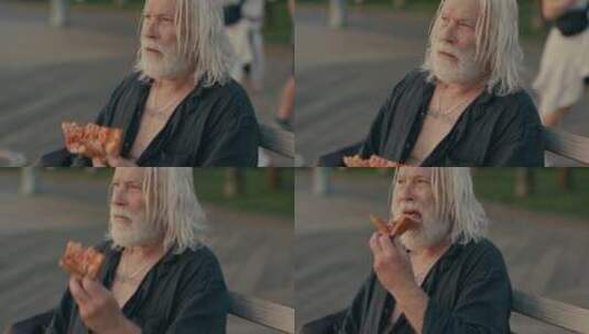 老年艺术家在街头吃披萨高清在线视频素材下载