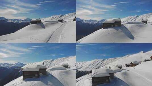 航拍坐落在高山上被大雪覆盖的村庄和道路高清在线视频素材下载