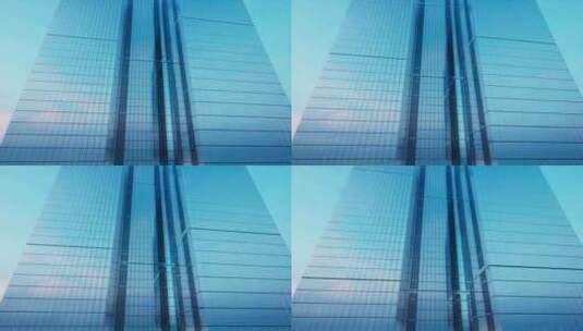 阳光下现代玻璃摩天大楼外观高清在线视频素材下载