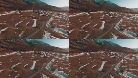 山脚下冰雪融化后的红土地高清在线视频素材下载