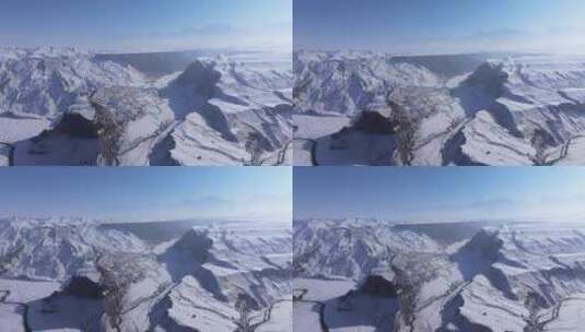 航拍新疆冬季安集海大峡谷雪山山脉高清在线视频素材下载