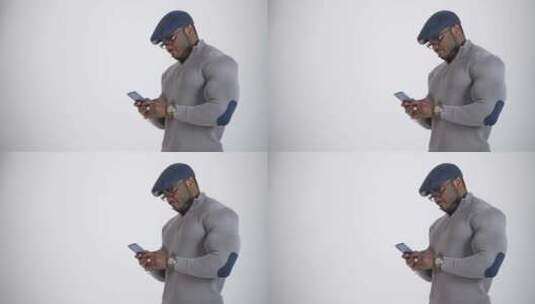 英俊的男人拿着手机在白色背景下高清在线视频素材下载