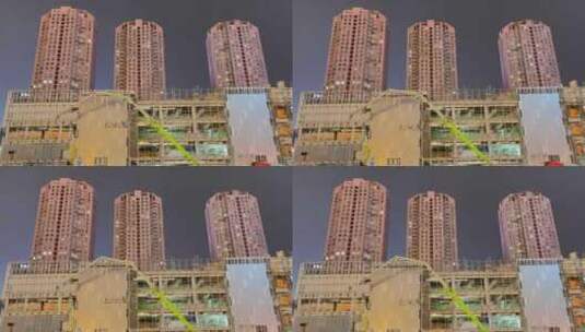 夜晚城市墙体建筑塔吊施工高清在线视频素材下载
