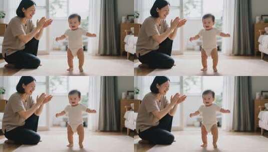母亲鼓励婴儿学步画面高清在线视频素材下载