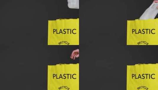 塑料纸箱被放入回收袋的中景照片高清在线视频素材下载