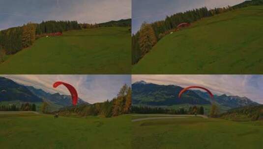 4K滑翔伞在蓝天白云草地树林间飞行高清在线视频素材下载