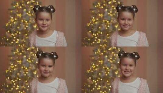 圣诞树前微笑的小女孩高清在线视频素材下载